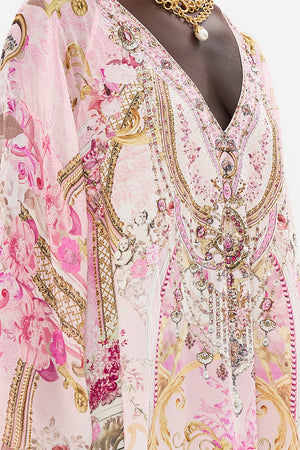 Detail view of model wearing CAMILLA pink silk kaftan in Fresco Fairytale print