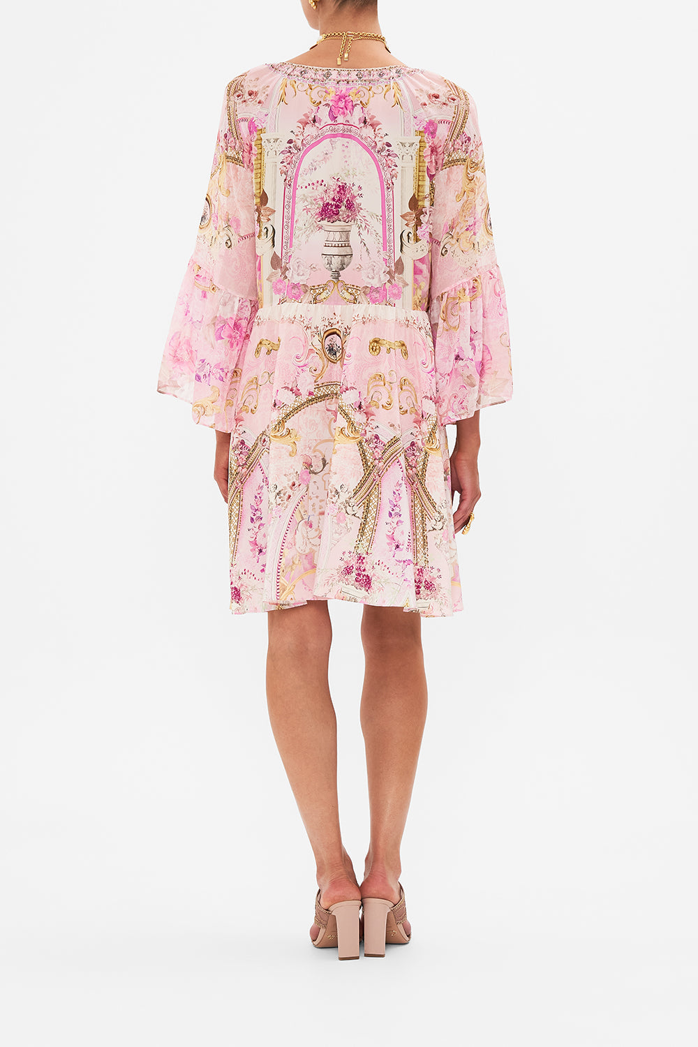 Back view of model wearing CAMILLA pink silk dress in Fresco Fairytale print 