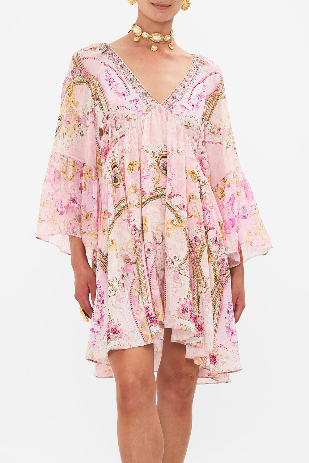 Crop view of model wearing CAMILLA pink silk dress in Fresco Fairytale print 