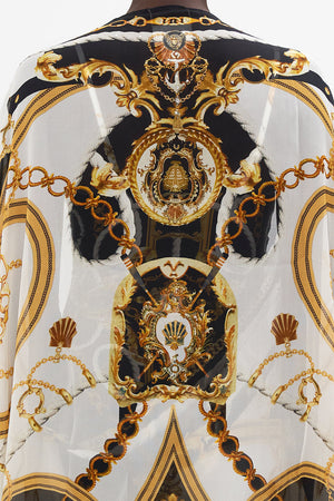 Detail view of model wearing  CAMILLA silk shrug in Sea Charm print 