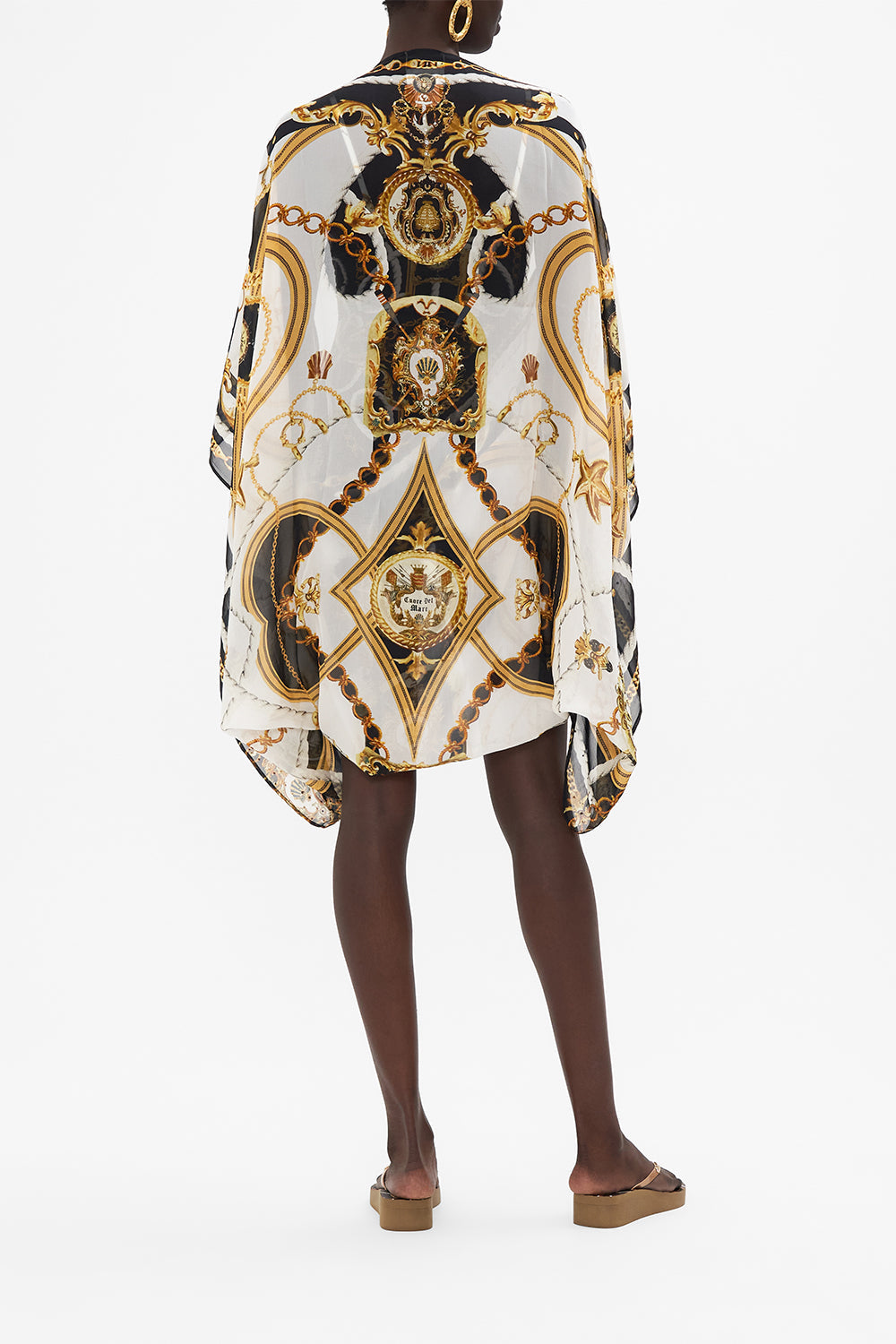 Back view of model wearing CAMILLA silk shrug in Sea Charm print 