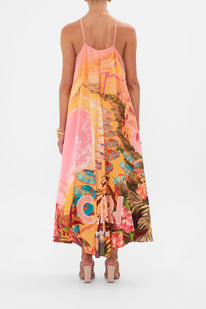Back view of model wearing CAMILLA sllk halter maxi dress in Capri Me print 