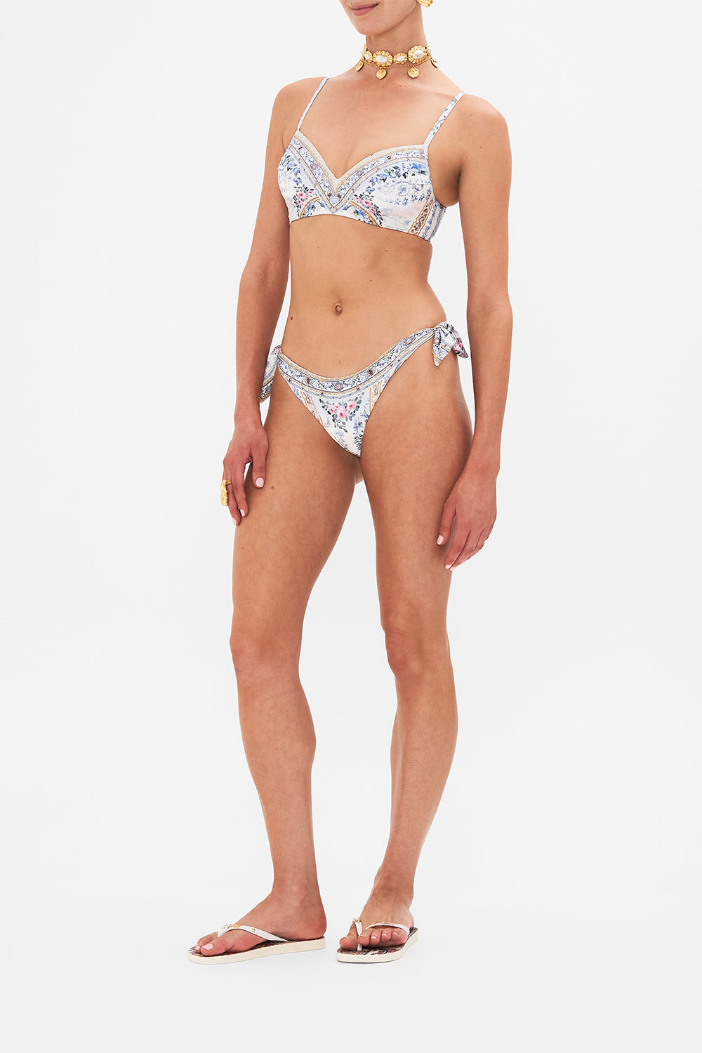 Side view of model wearing CAMILLA silk pants in Season Odf The Siren print 