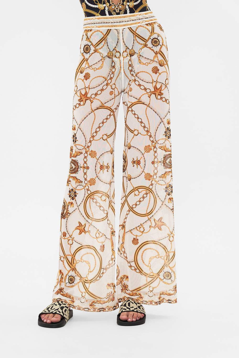 Crop view of model wearing CAMILLA sheer mesh pants in Coast To Coast print 