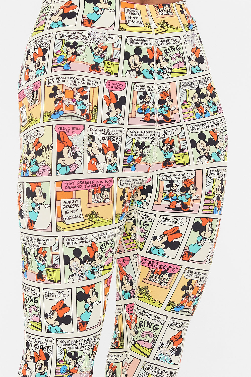 Detail view of model wearing CAMILLA x Disney leggings in A Trip Down Comic Strip print