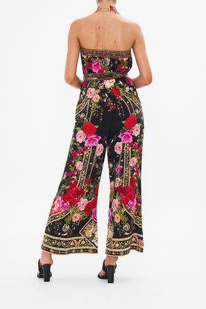 Back view of model wearing CAMILLA floral silk jumpsuit  in Reservation For Love print