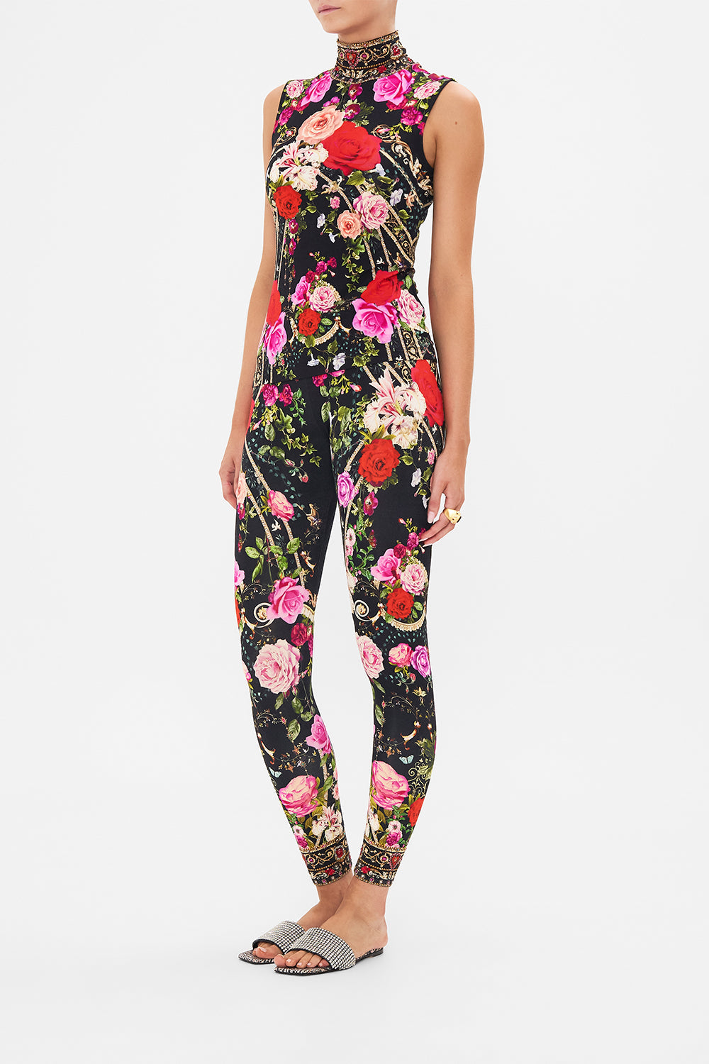 Side view of model wearing CAMILLA jersey sleeveless turleneck top in Reservation For Love print