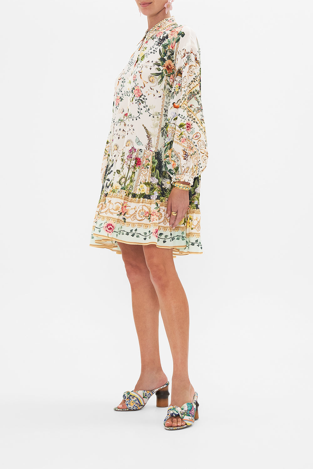 Side view of model wearing CAMILLA silk shirt dress in Renaissance Romance print