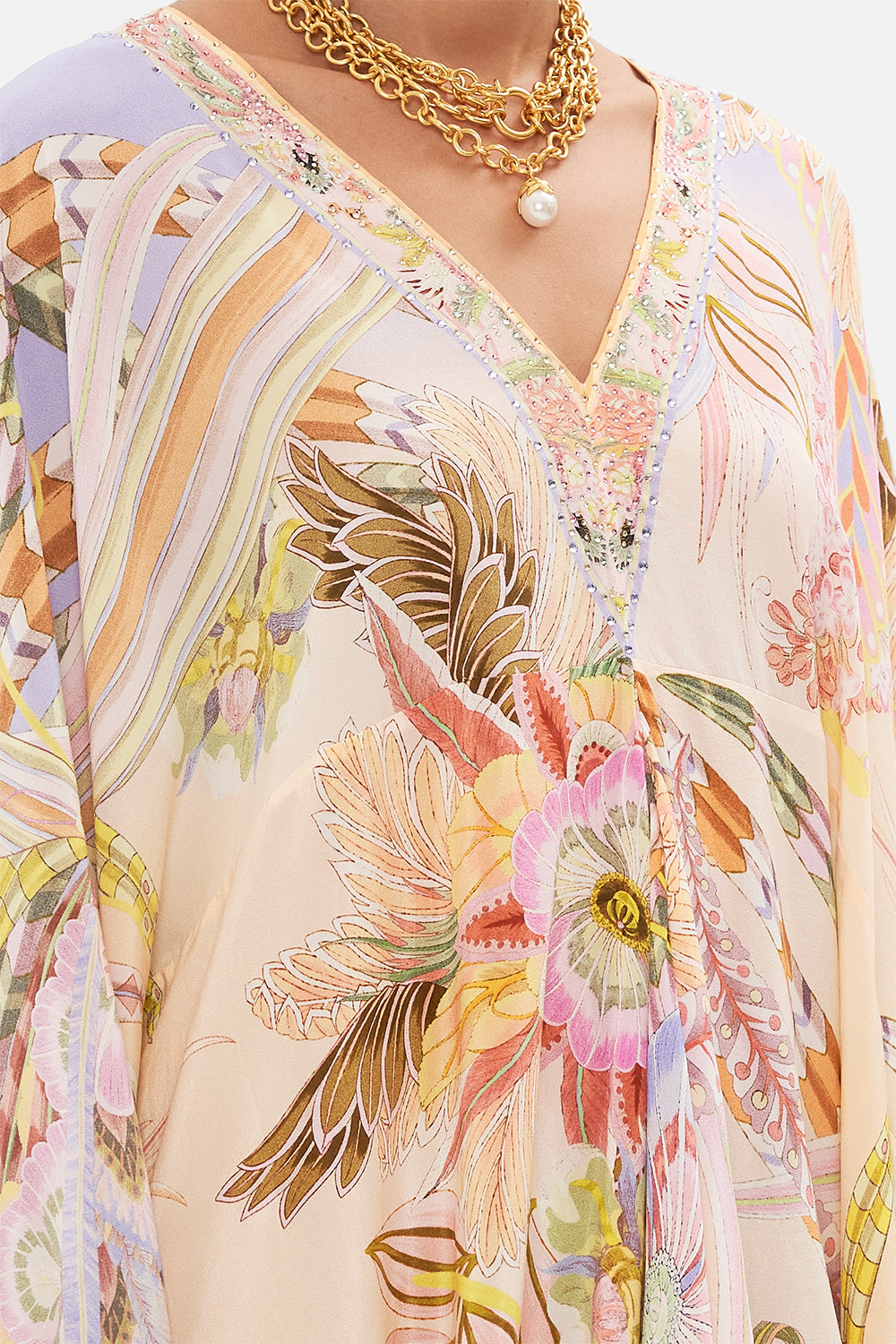 Detail view of model wearing CAMILLA silk kaftan in Cosmic Tuscan print