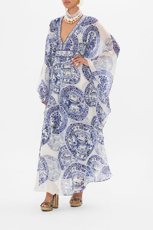 Side view of model wearing CAMILLA silk kaftan in Glaze and Graze print 
