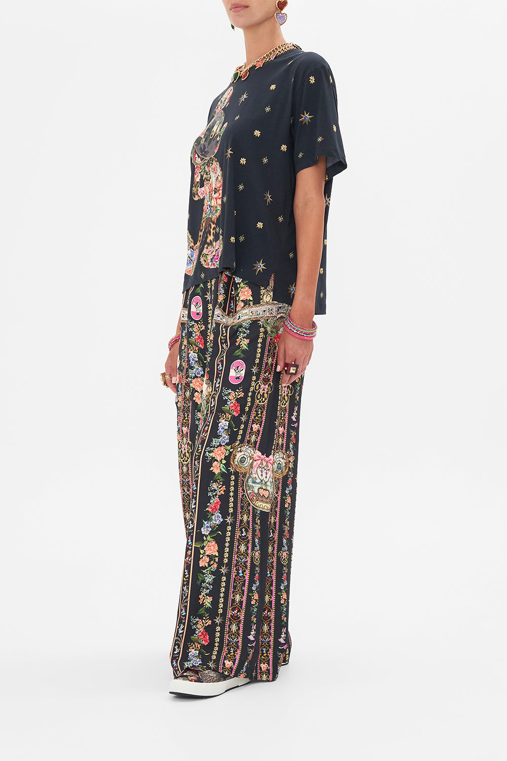 Side view of model wearing Disney x CAMILLA womens black t shirt in Midnight At Minnies 