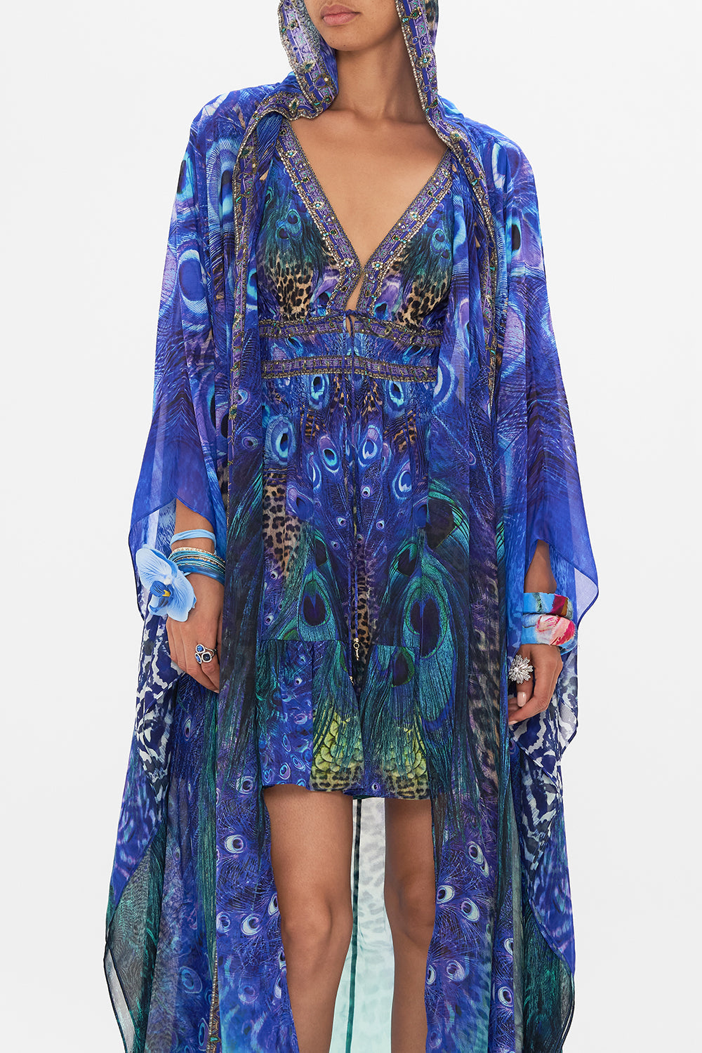 Crop view of model wearing CAMILLA silk robe in Peacock Rock print