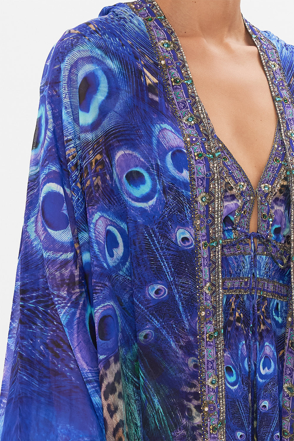 Detail view of model wearing CAMILLA silk robe in Peacock Rock print