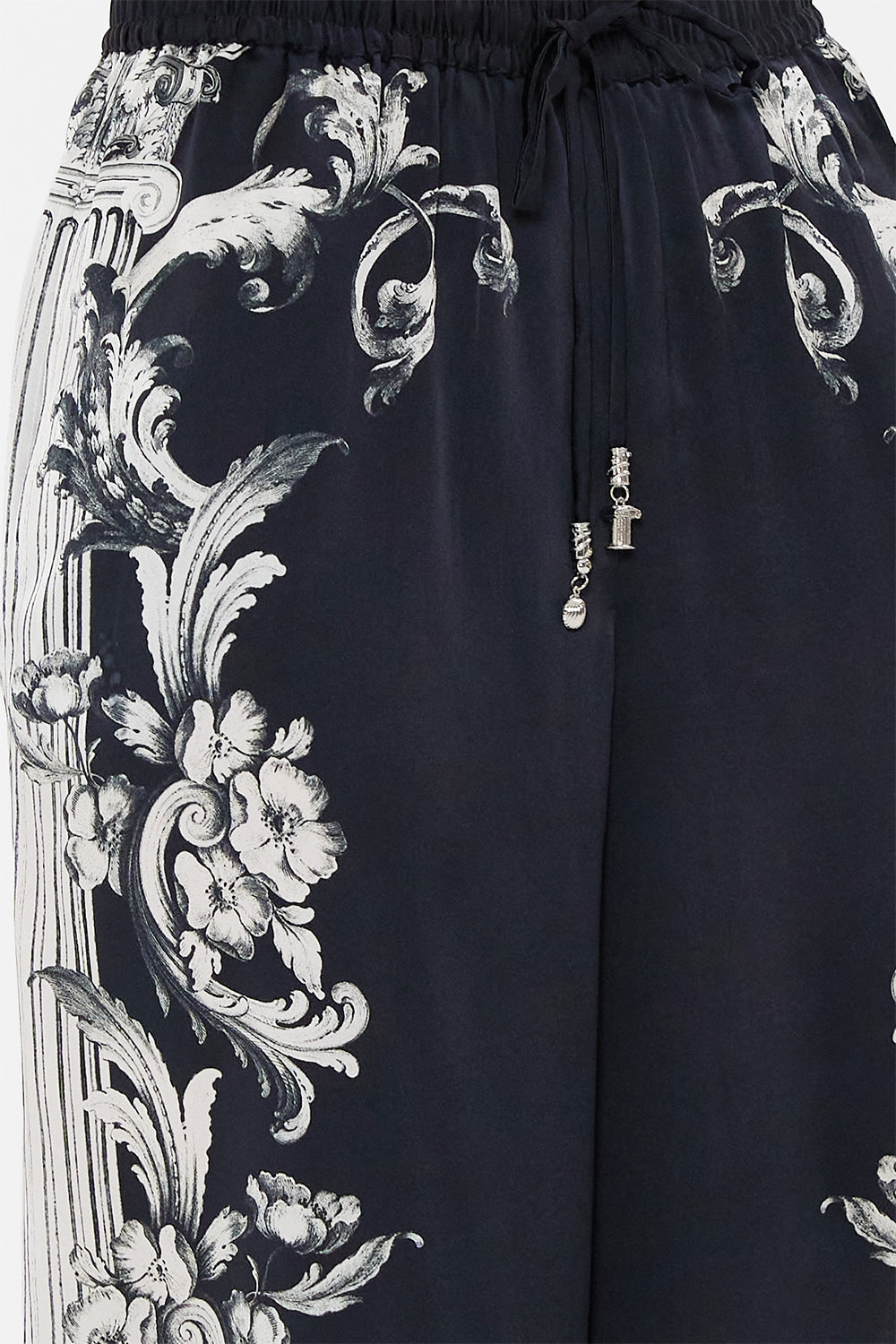 The CAMILLA METAL EYELET KAFTAN ROCOCO GLOW in our  print.