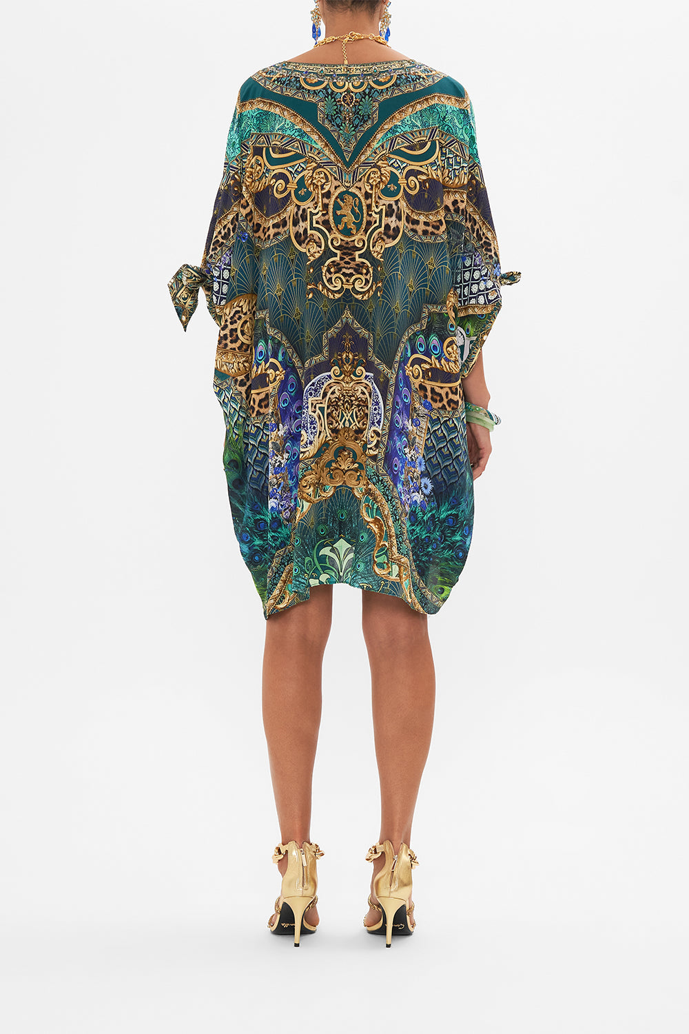 Back view of model wearing CAMILLA short silk kaftan in Fan Dance print