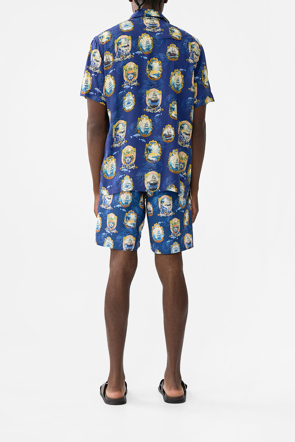 The CAMILLA OVERSIZED BAND TEE WELCOME TO THE WHITE LOTUS in our  print.