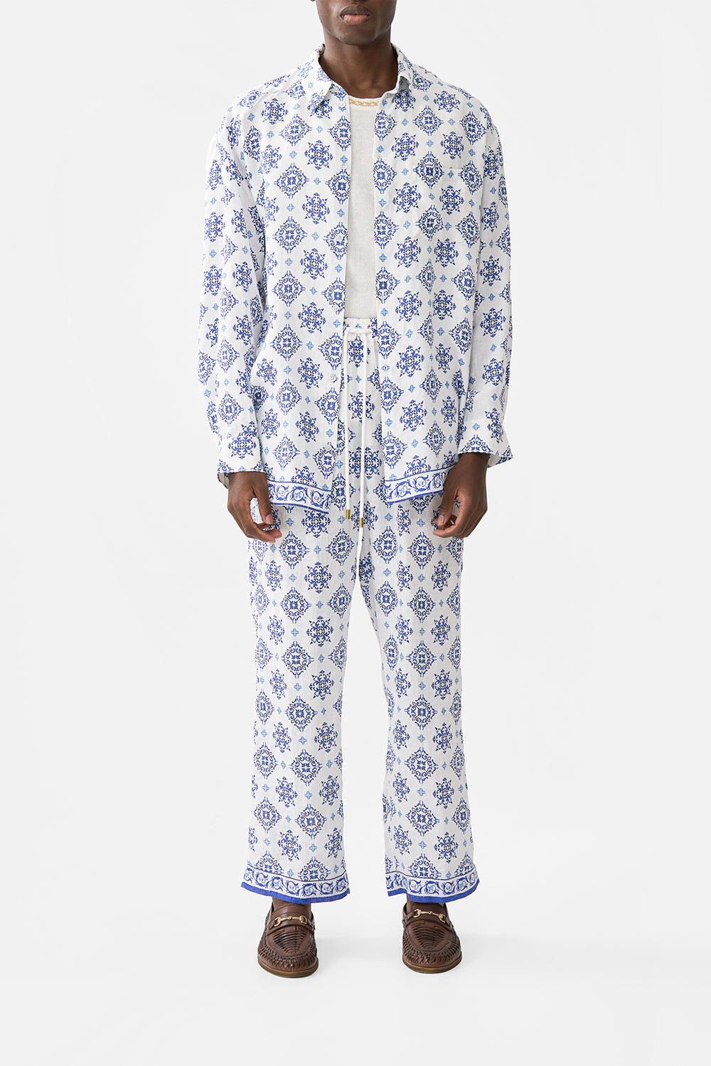 The CAMILLA SHORT TASSEL SARONG FAITH, LUCK & JUSTICE in our  print.