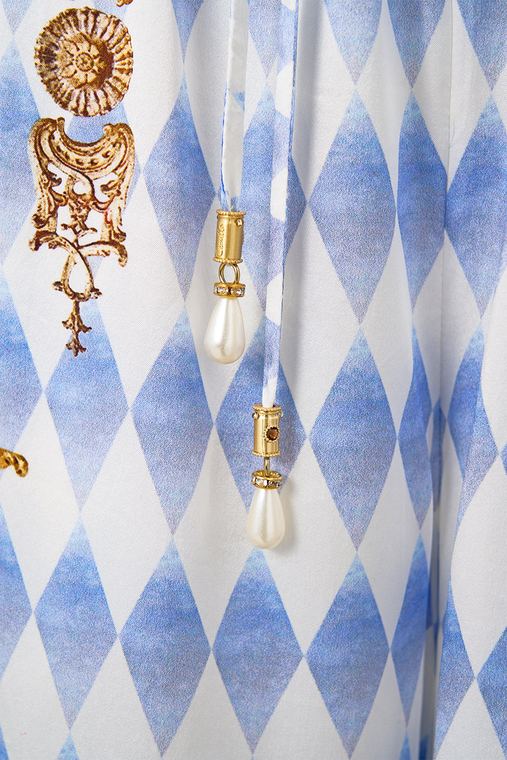 The CAMILLA STEPPED HEM SHIRT SONG OF SAINT ANTHONY in our  print.