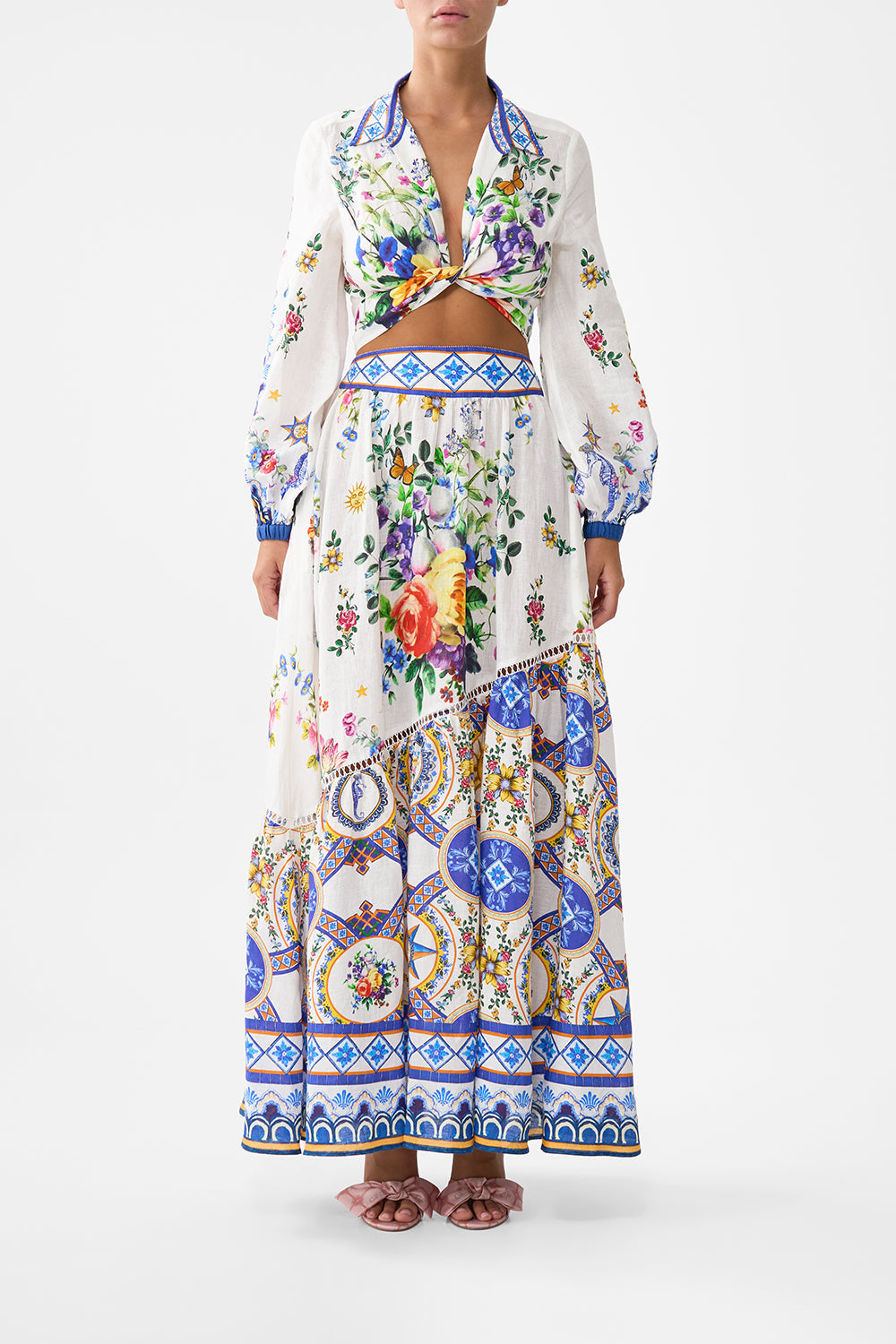 The CAMILLA EYELET WRAP MINI SKIRT WITH TIE WAIST SPIRIT OF SANTA MARIA in our  print.