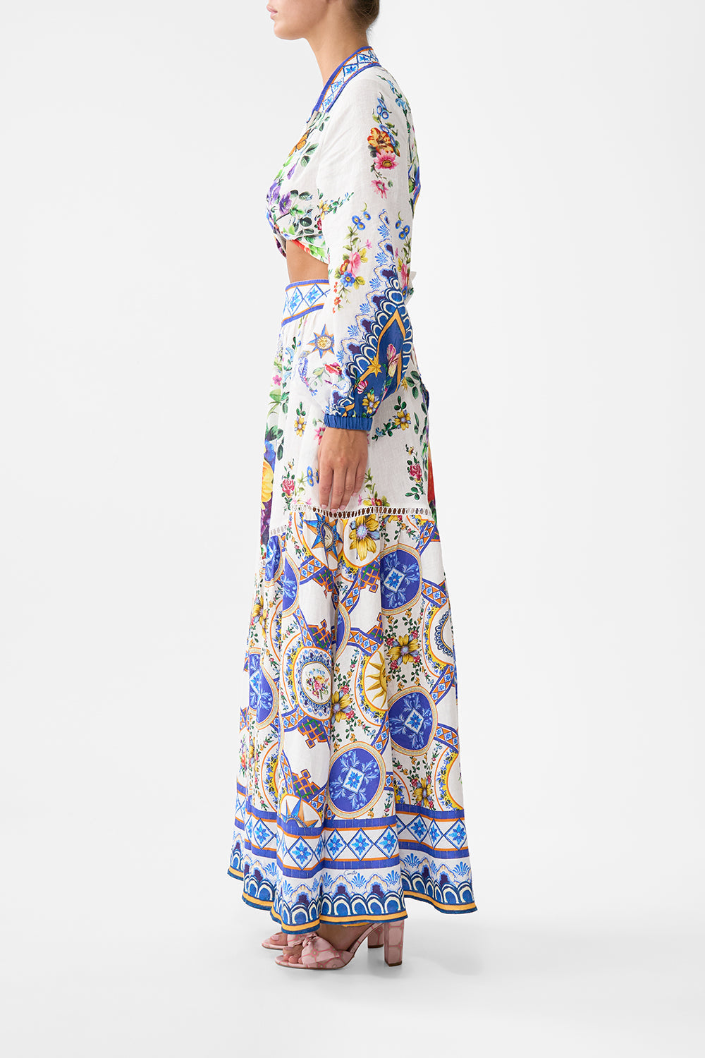 The CAMILLA EYELET WRAP MINI SKIRT WITH TIE WAIST SPIRIT OF SANTA MARIA in our  print.