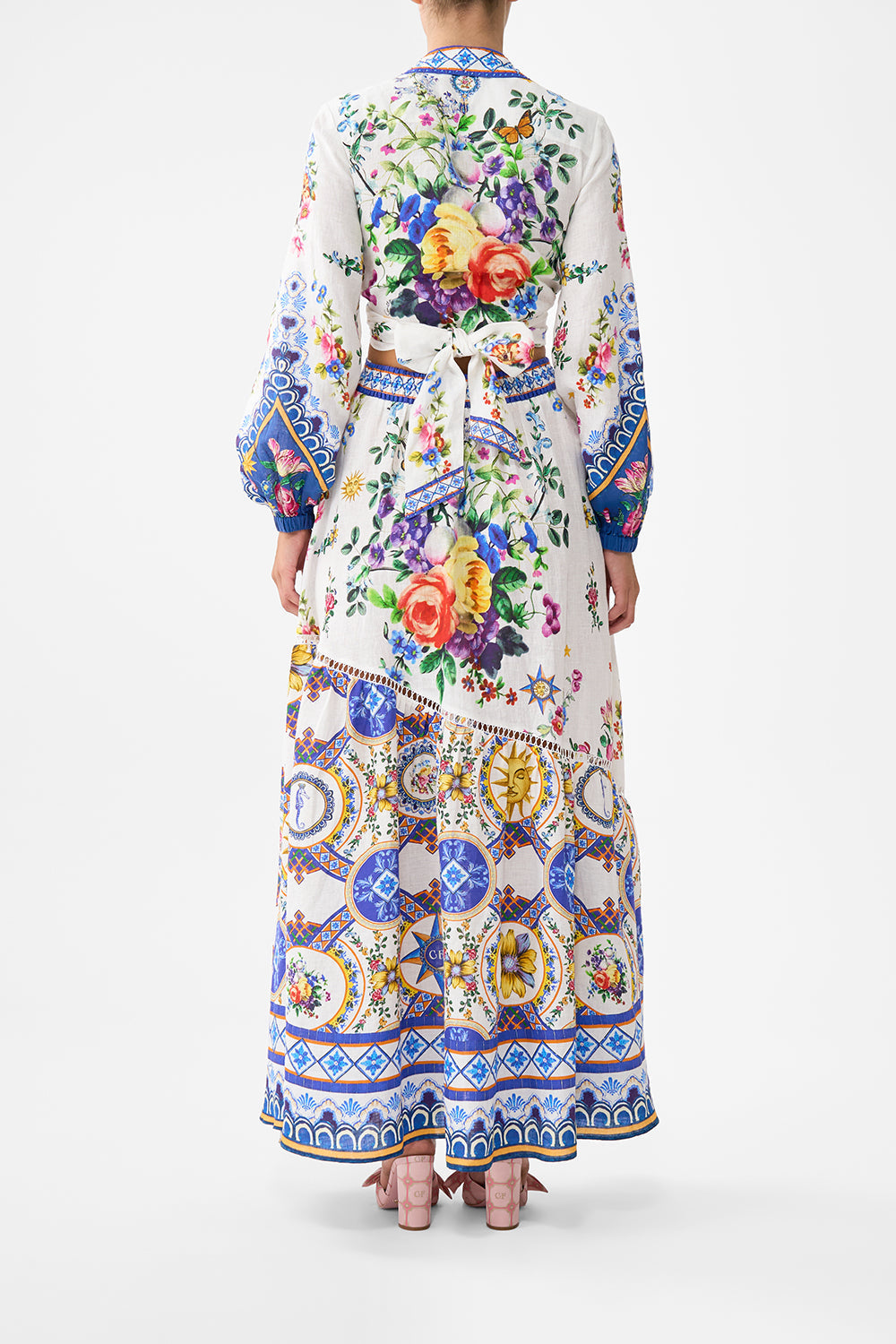 The CAMILLA EYELET WRAP MINI SKIRT WITH TIE WAIST SPIRIT OF SANTA MARIA in our  print.