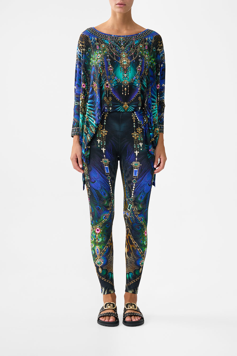 The CAMILLA BANDEAU ONE PIECE WITH EYELET TIE SIDES MAGIC CARPET RIDE in our  print.