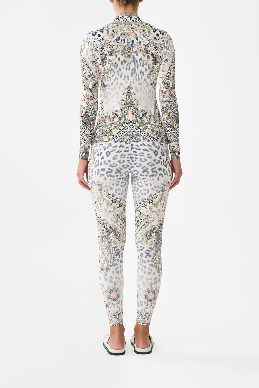 The CAMILLA BUTTON FRONT HALTER PLAYSUIT NOTES FROM THE ROAD in our  print.