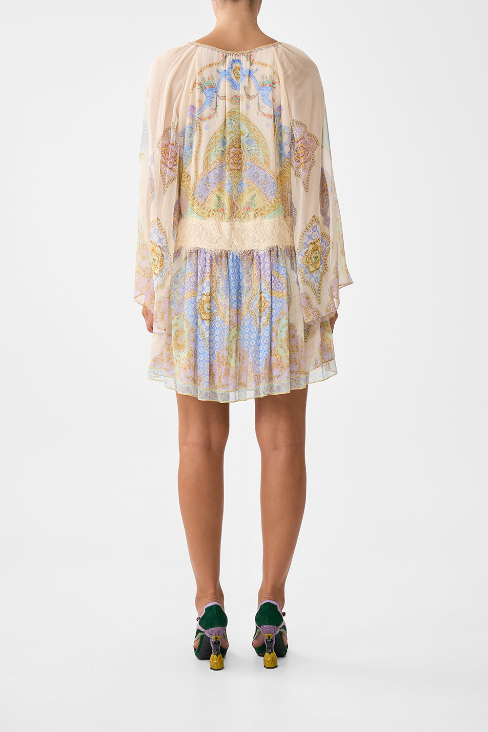 The CAMILLA WAISTED DRESS WITH HEM RUFFLE COSMIC ZOOLOGY in our  print.