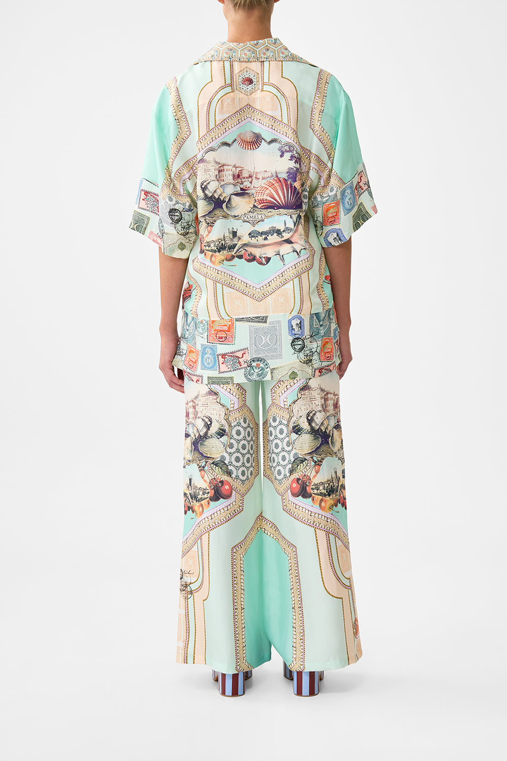 The CAMILLA PLUNGE NECK DRAPED SHOULDER DRESS THE IMPERIAL GATE in our  print.