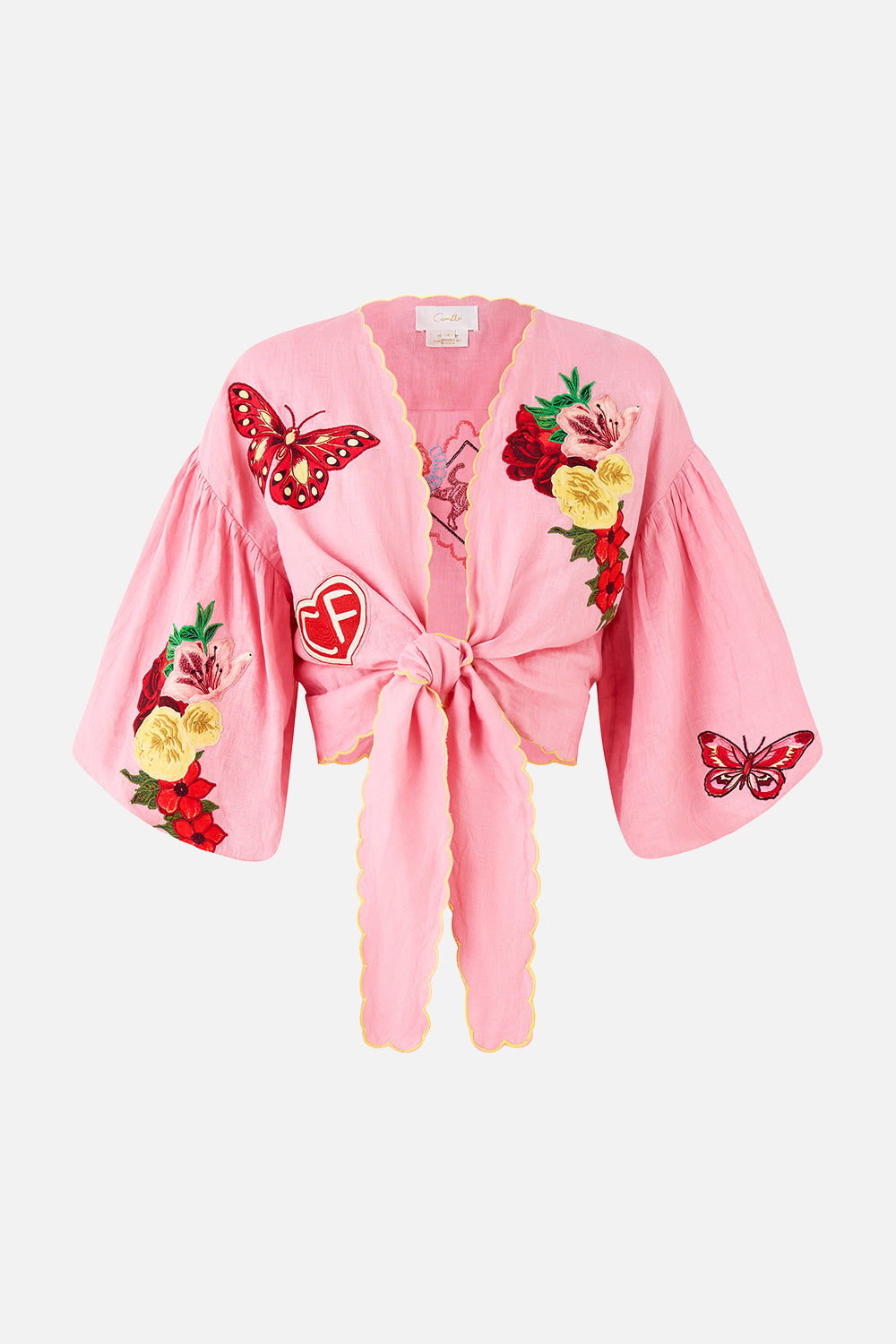 The CAMILLA CROPPED BLOUSON SLEEVE TIE FRONT TOP LEGEND HAS IT in our LEGEND HAS IT print.