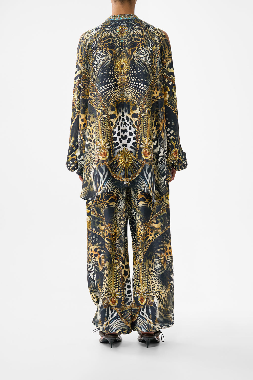 The CAMILLA MID LENGTH BOARDSHORT WITH ELASTIC WAIST AMULETS AND ALCHEMY in our  print.