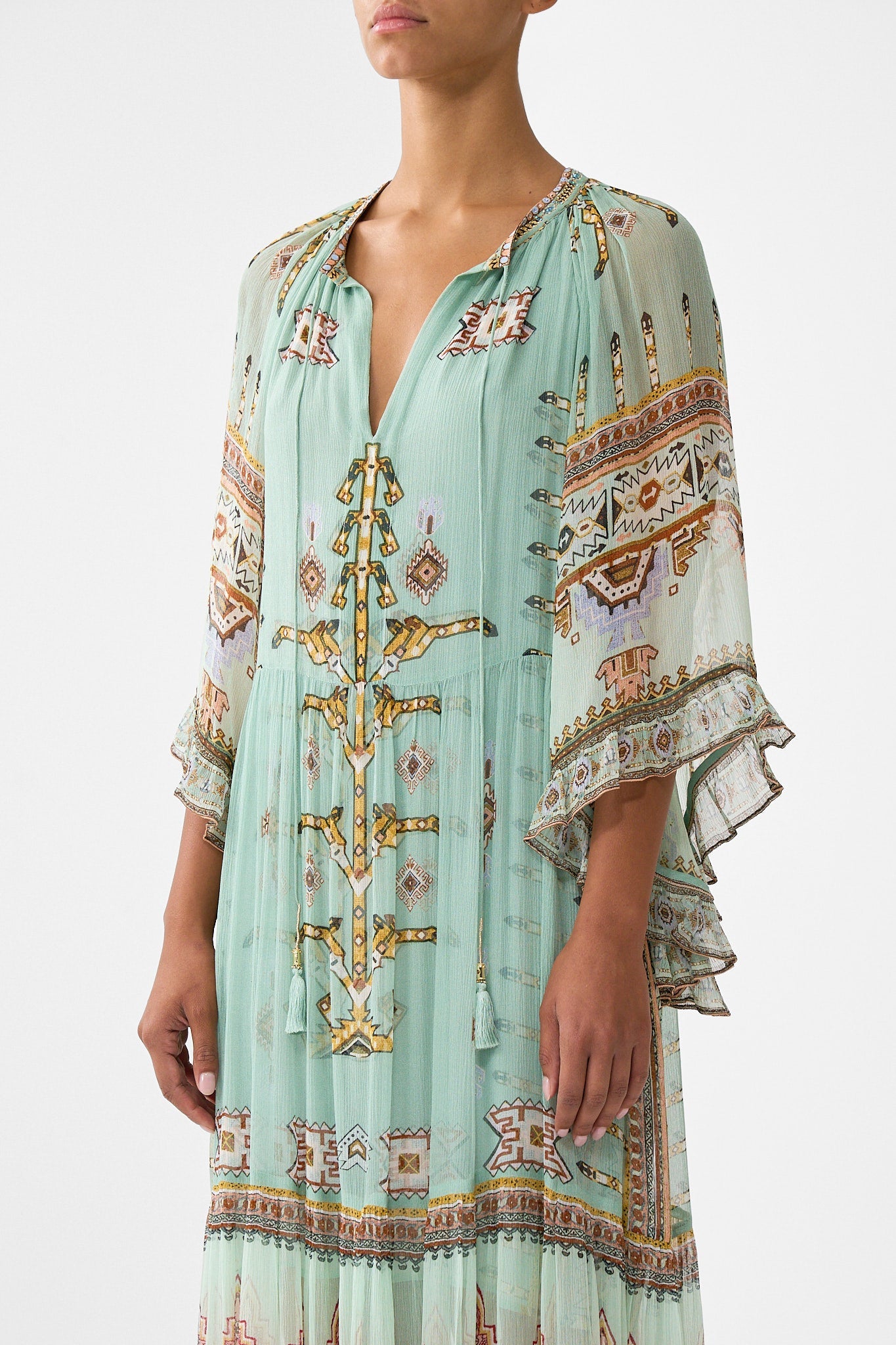 The CAMILLA CRINKLE STRETCH SCOOP NECK ONE PIECE WITH STRAP TRIMS FELINE FOLKLORE in our  print.