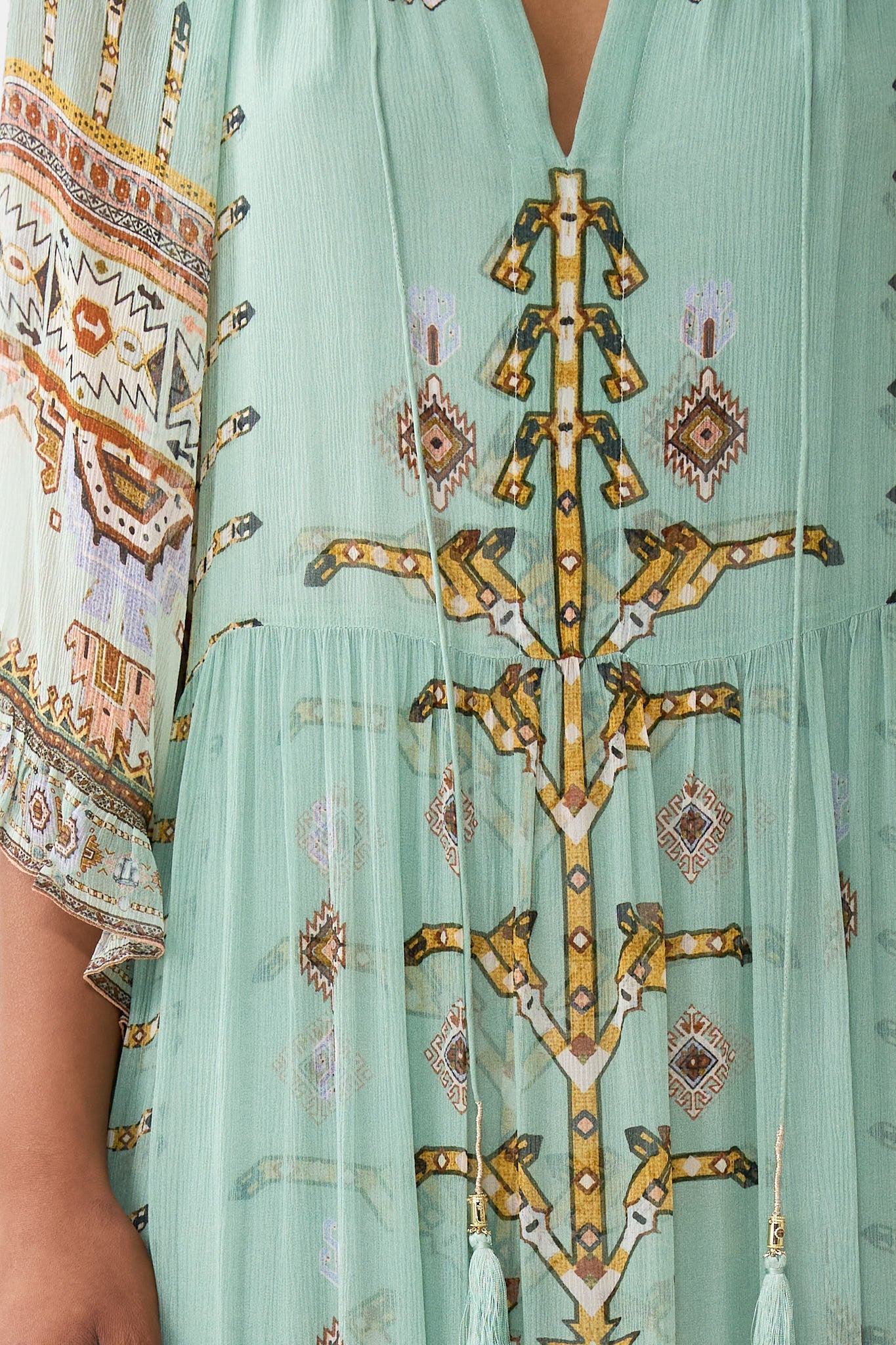 The CAMILLA CRINKLE STRETCH SCOOP NECK ONE PIECE WITH STRAP TRIMS FELINE FOLKLORE in our  print.