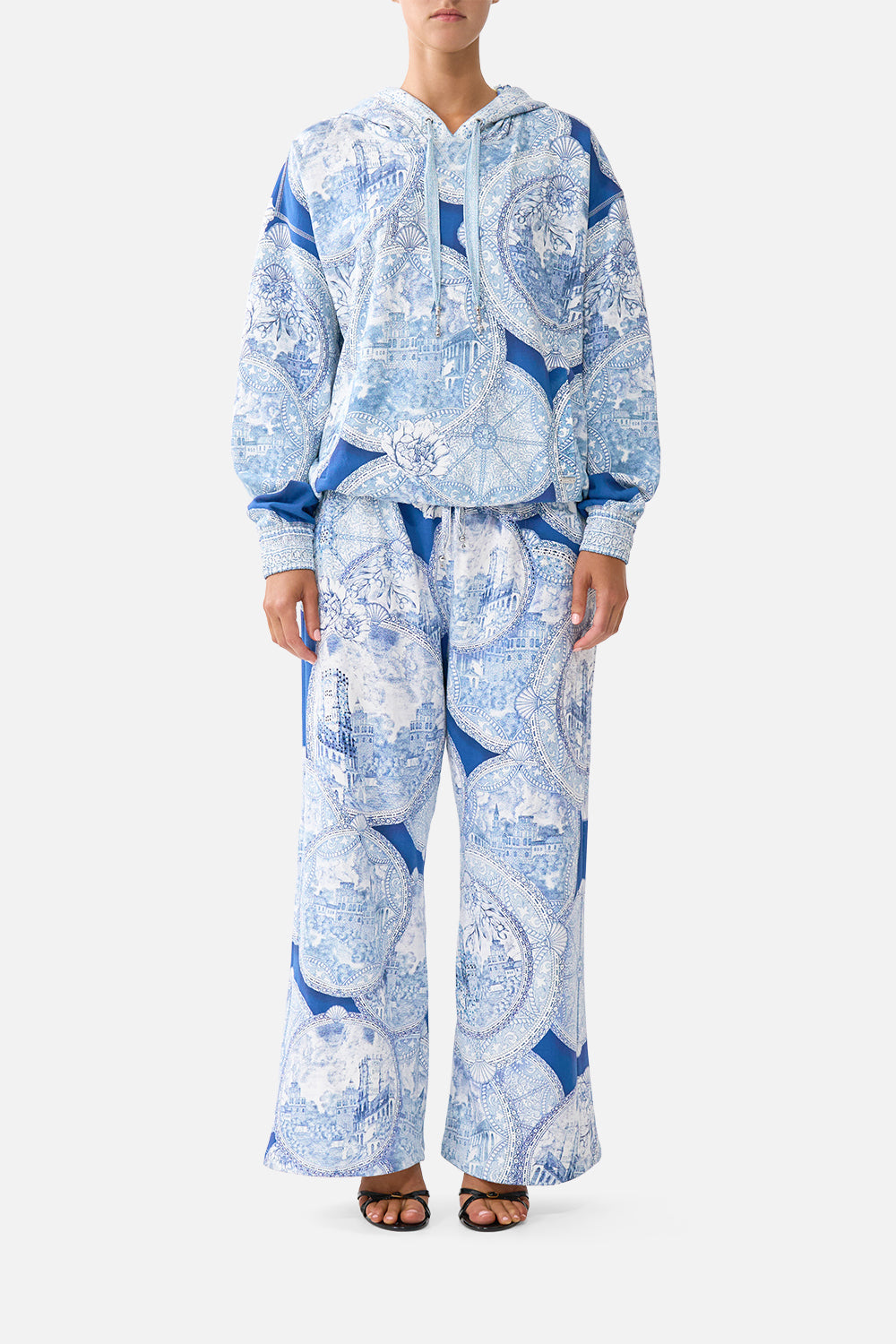 The CAMILLA TIE FRONT ONE PIECE WITH FRILL NECK AND WAIST DAUGHTERS OF DUENDE in our  print.