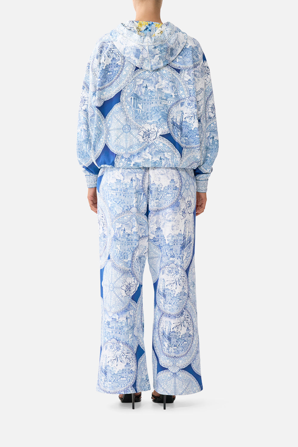 The CAMILLA TIE FRONT ONE PIECE WITH FRILL NECK AND WAIST DAUGHTERS OF DUENDE in our  print.