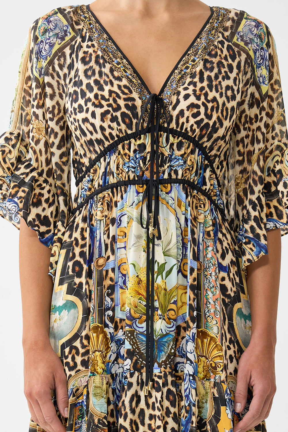 The CAMILLA CROPPED WRAP SHIRT THE HUM OF THE ALHAMBRA in our  print.