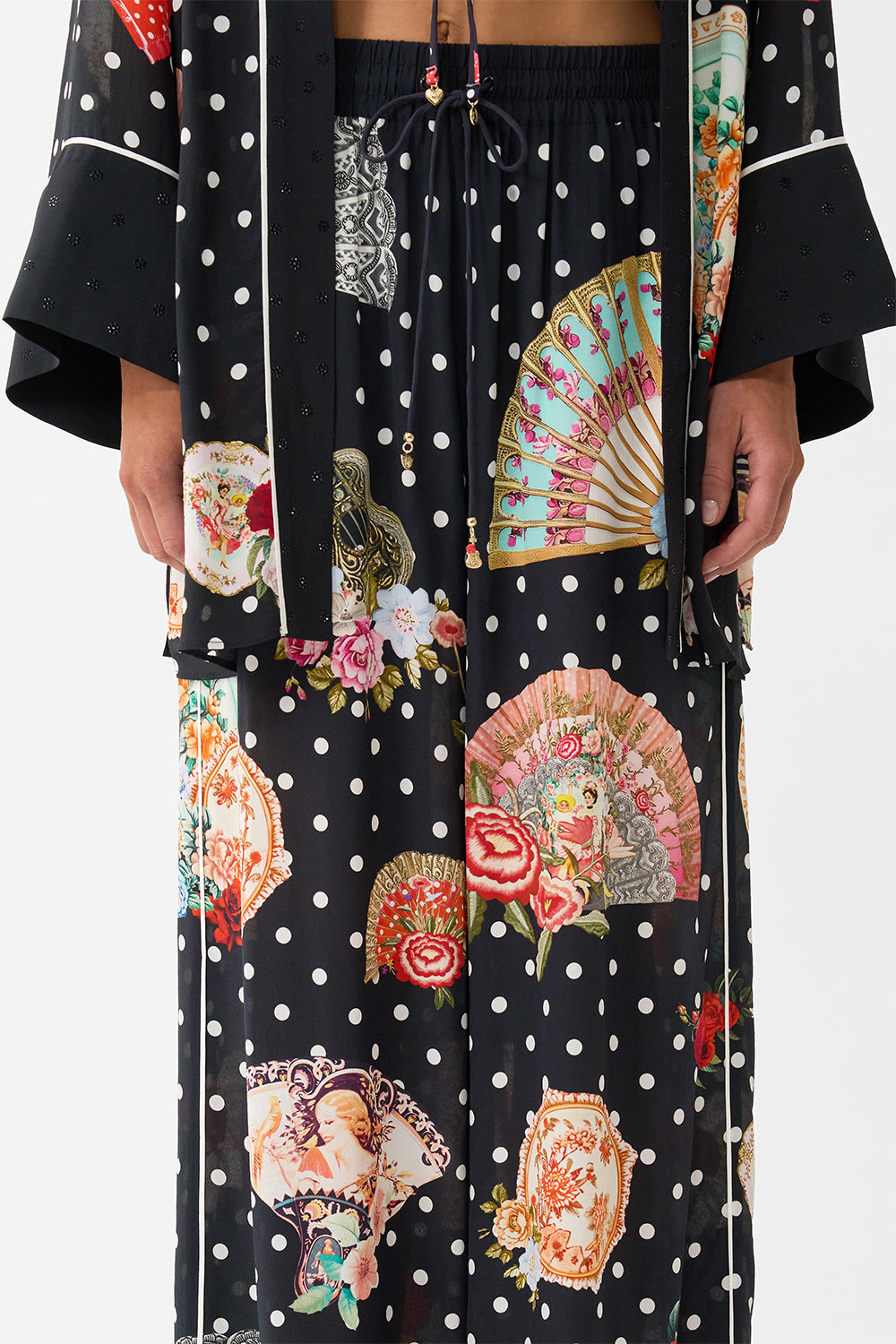 The CAMILLA MULTI WEAR BEACH MIDI DRESS WITH RING FRONT SEVILLIAN STYLE in our  print.