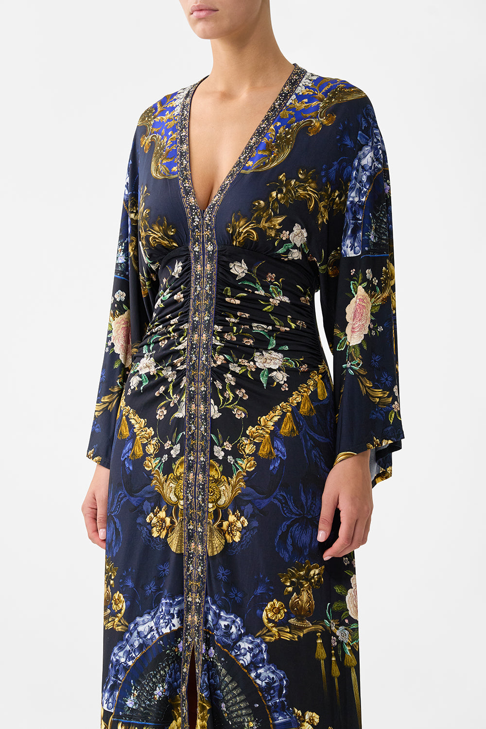 The CAMILLA FUNNEL NECK KNIT PONCHO NOTES FROM THE BLUE ROOM in our  print.