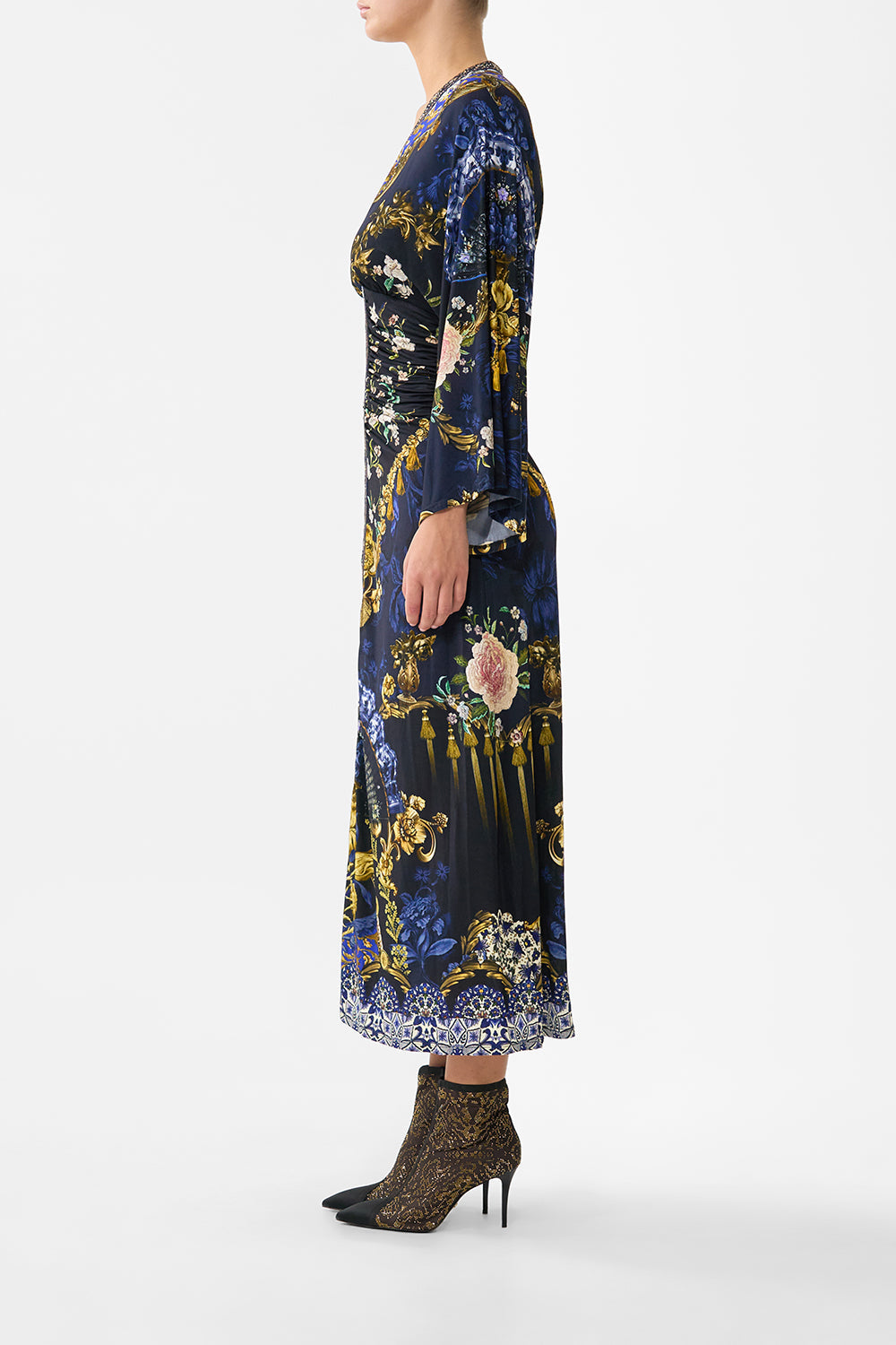 The CAMILLA FUNNEL NECK KNIT PONCHO NOTES FROM THE BLUE ROOM in our  print.