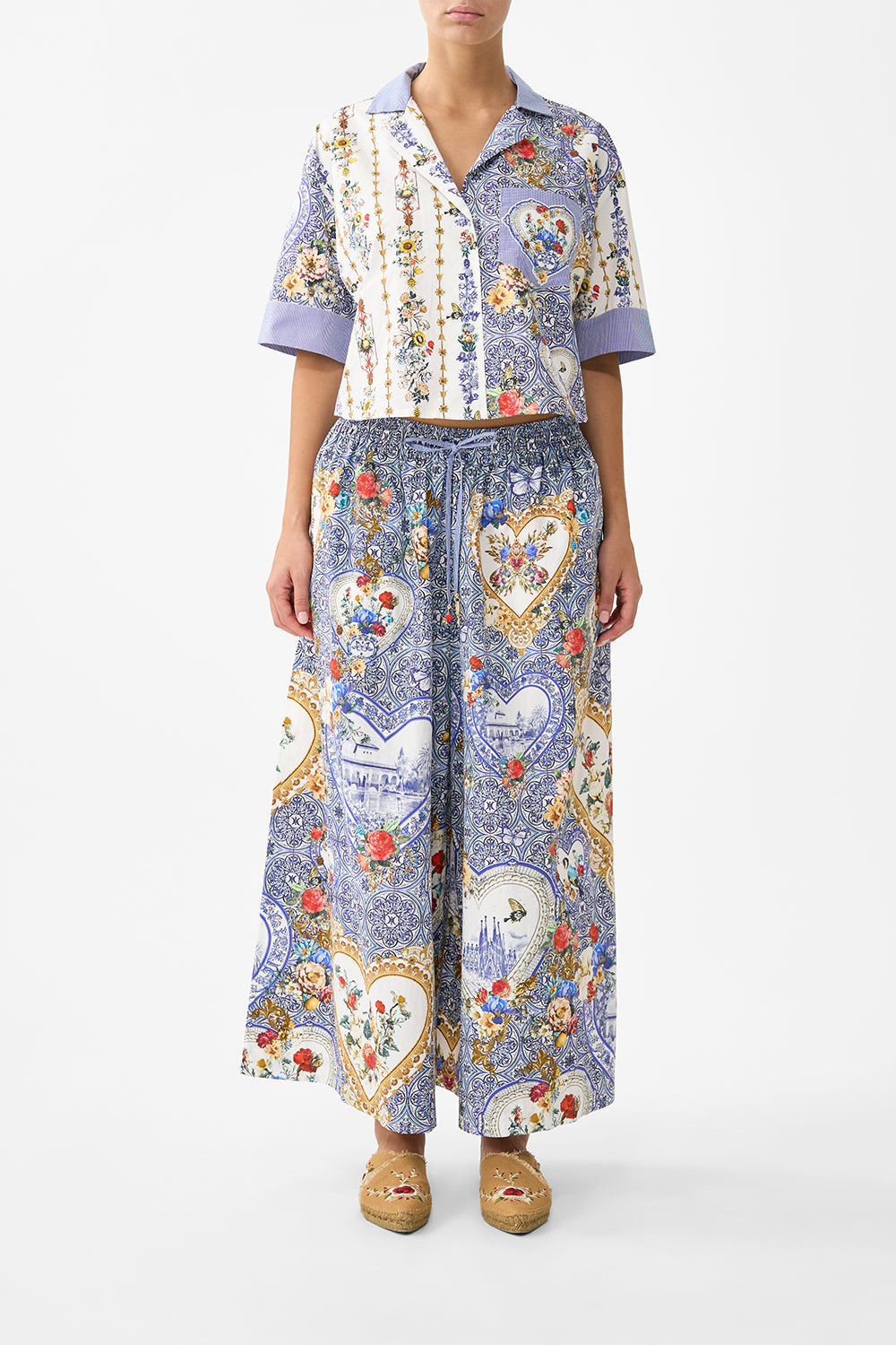 The CAMILLA GATHERED CUFF V NECK TOP DAUGHTERS OF DUENDE in our  print.