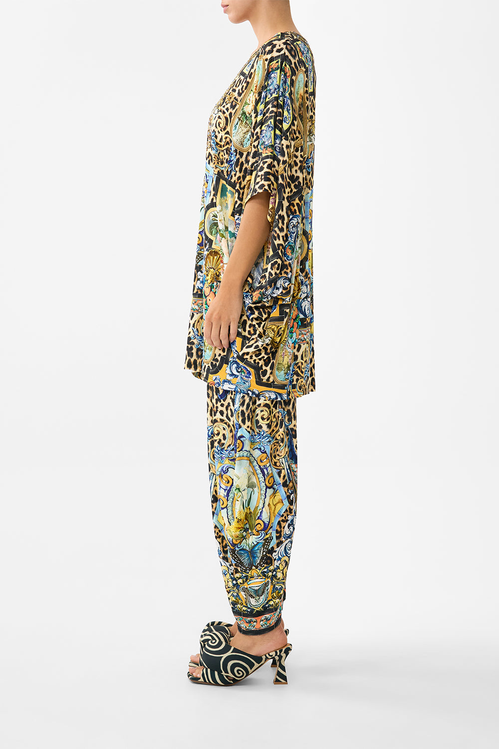 The CAMILLA MID LENGTH BOARDSHORT WITH ELASTIC WAIST DE NADA GRANADA in our DE NADA GRANADA print.