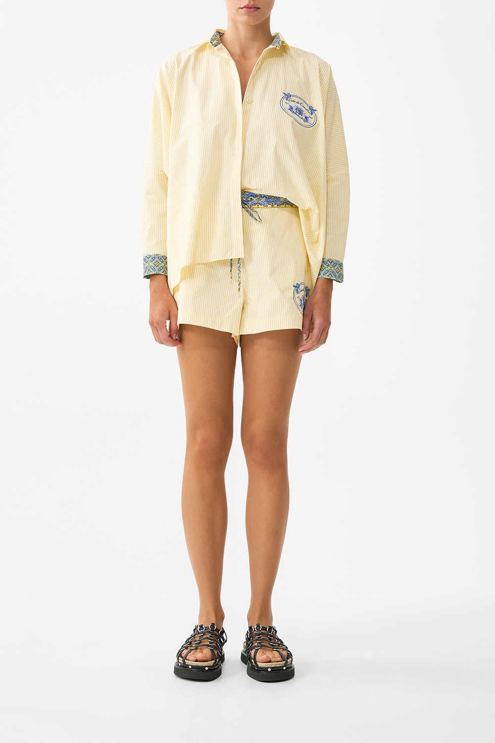 The CAMILLA TIERED SHORT DRESS WITH NECK FRILL SACROMONTE SEÑORITA in our  print.