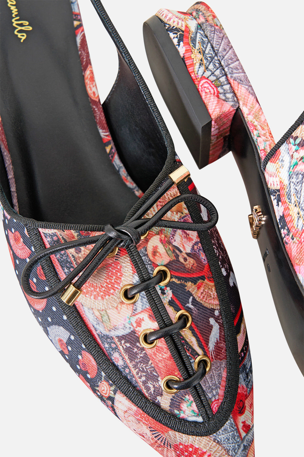 The CAMILLA GATHERED CUFF V NECK TOP DAUGHTERS OF DUENDE in our  print.