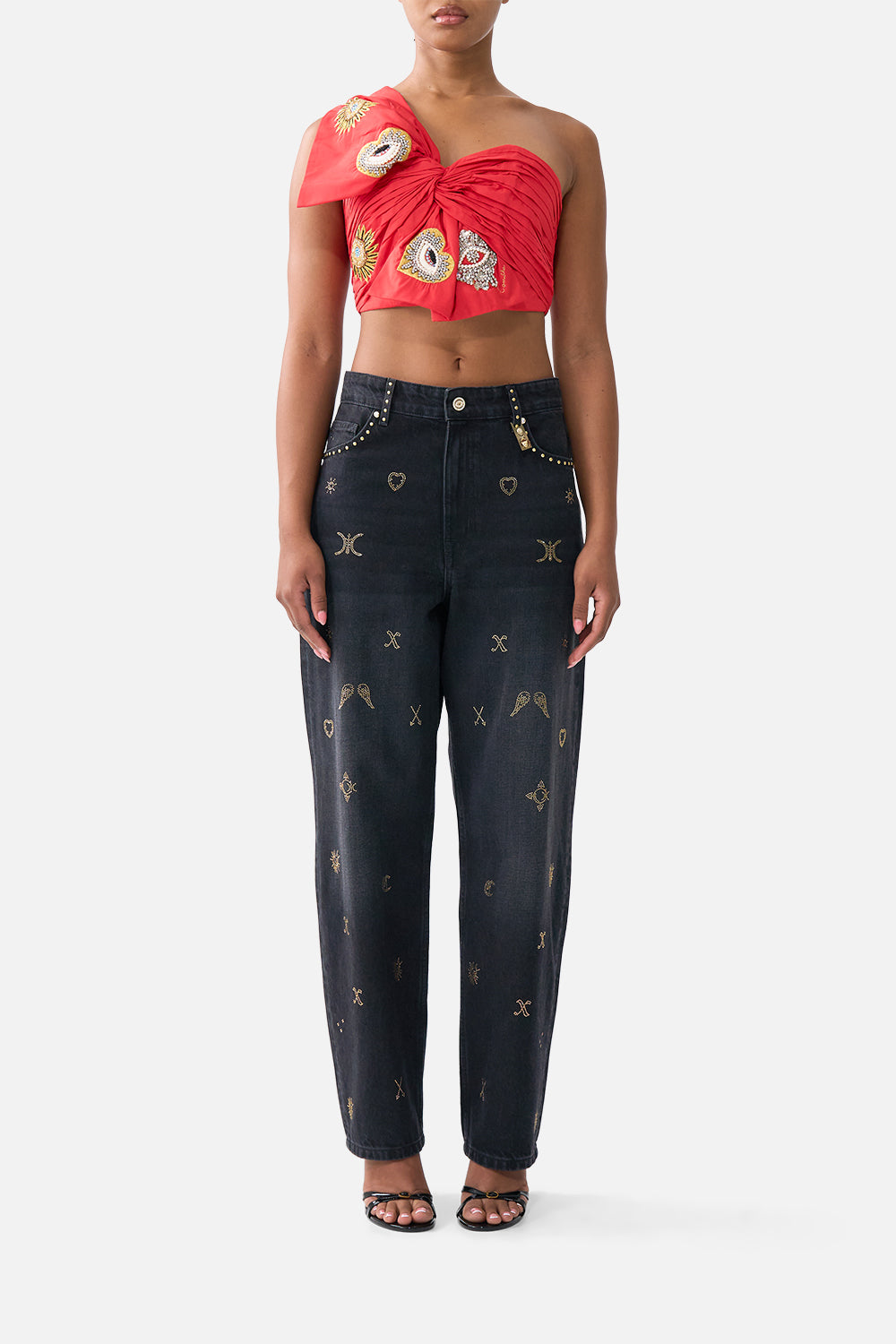 The CAMILLA HIGH TRI ONE PIECE WITH EYELET TIE FRONT TRIM ESPAÑA NIRVANA in our  print.