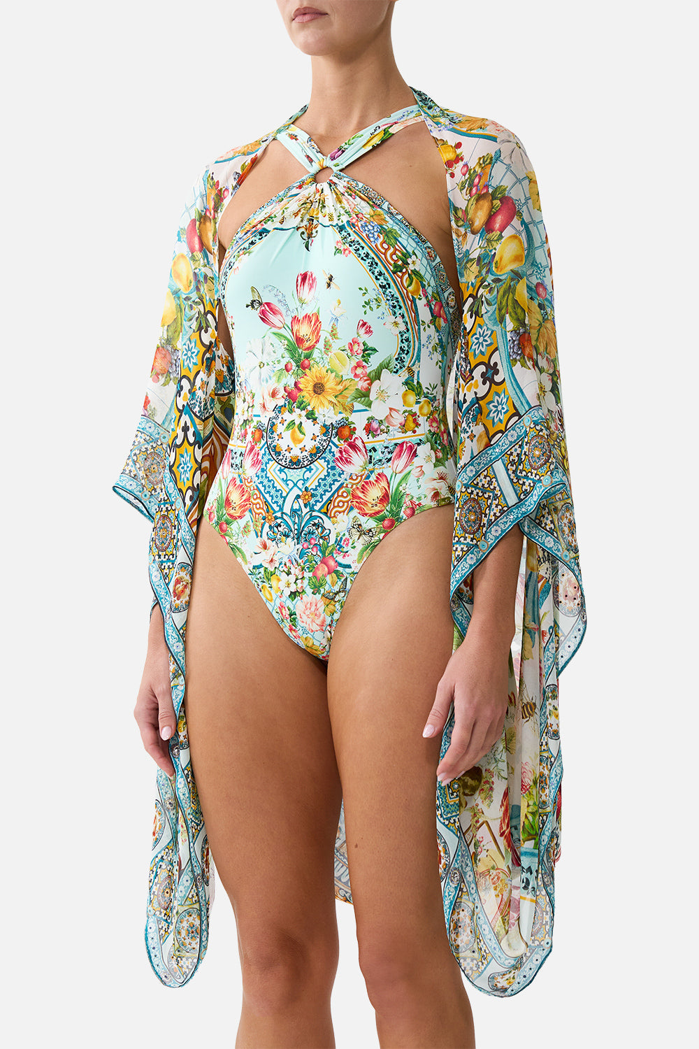 The CAMILLA PLUNGE HALTER ONE PIECE WITH BAR FRONT TRIM DE NADA GRANADA in our  print.