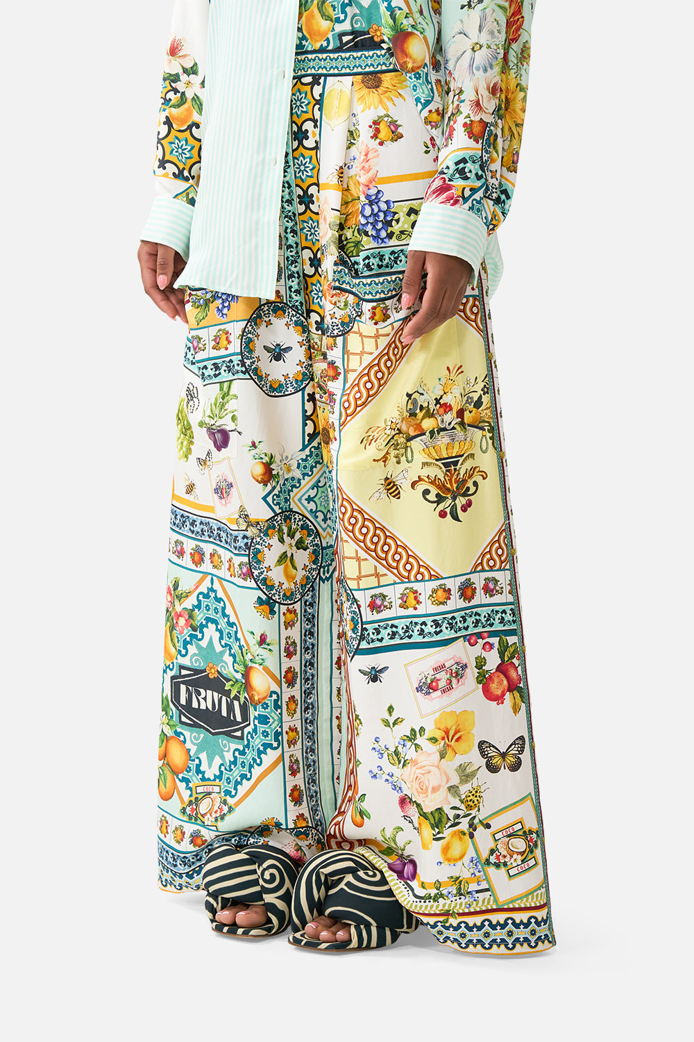 The CAMILLA FAUX FUR BOMBER WITH POCKET DETAILS FIESTA, SIESTA, REPEAT in our FIESTA, SIESTA, REPEAT print.
