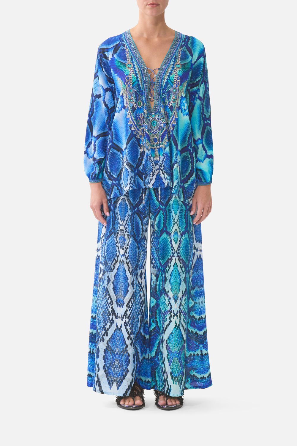 The CAMILLA JERSEY FLARED PANT FIESTA, SIESTA, REPEAT in our  print.