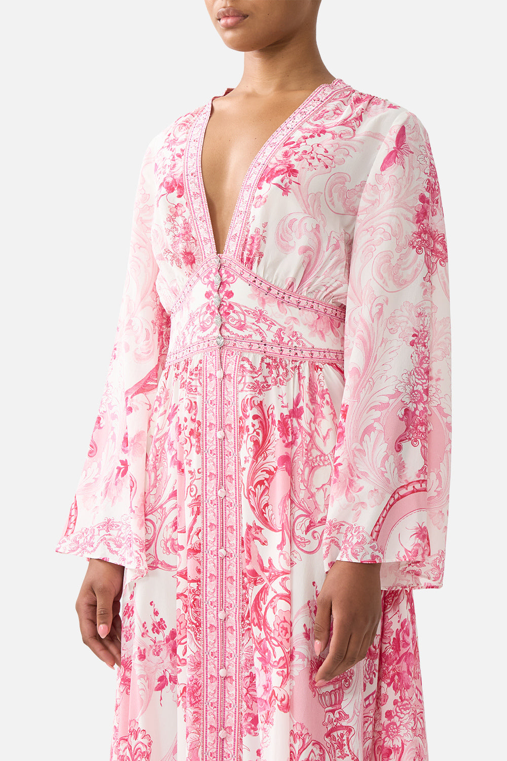 The CAMILLA FAUX FUR BOMBER WITH POCKET DETAILS FIESTA, SIESTA, REPEAT in our  print.