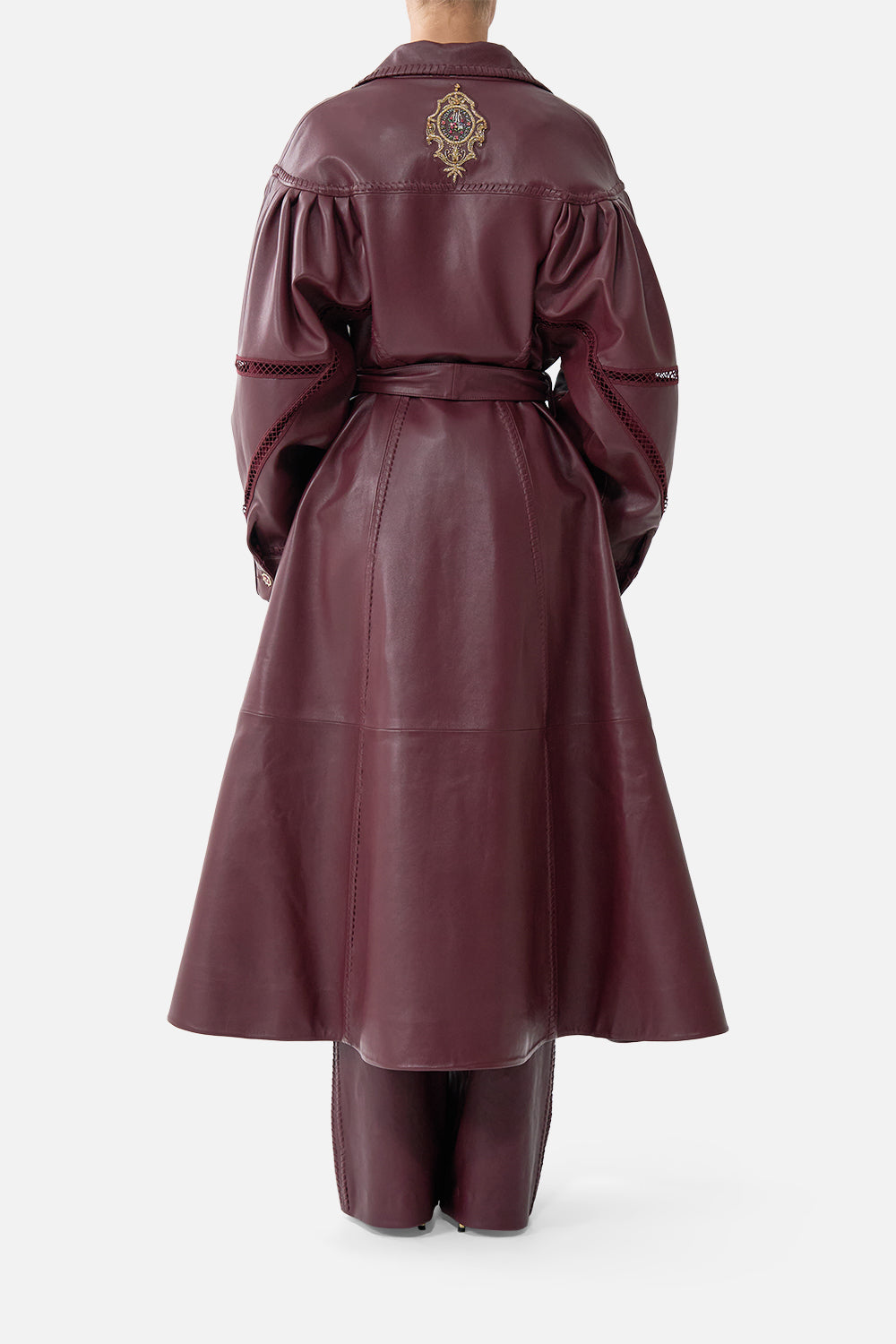 The CAMILLA Leather Coat with Tucked Sleeves in our Call Me a Carriage print, back view on model.