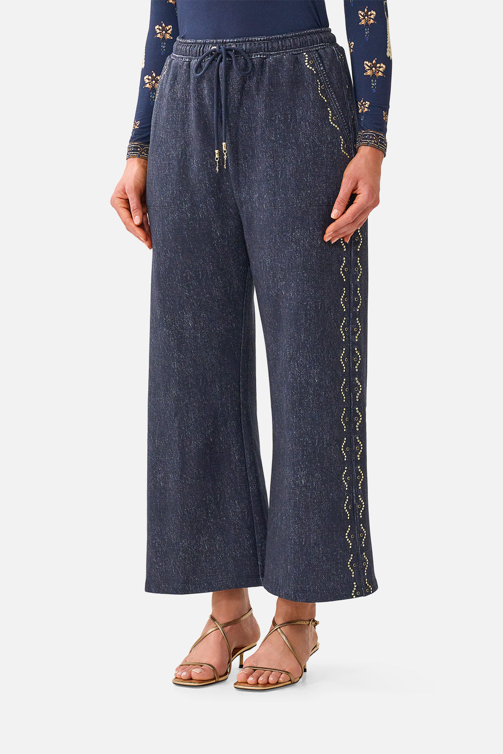 The CAMILLA Straight Leg Track Pant in our Cloaked in Baroque print, detail view on model.